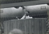 Man speaking at a podium