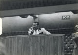 Man speaking at a podium