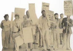 Cut out image of protesters with signs, "Support fight against discrimination"