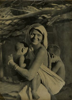 Woman carrying two children