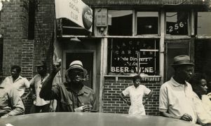 People gathered outside a social club