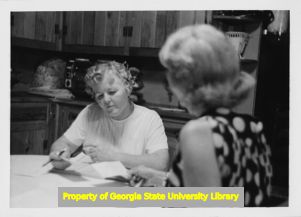 Two women go over documents in Cartersville, Georgia.