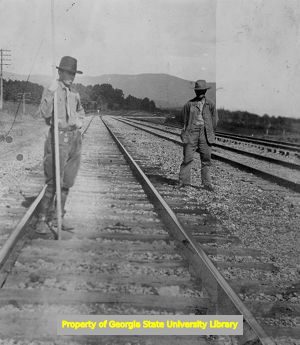 Norfolk and Western Railway Company workers on railroad tracks, C. J. French collection