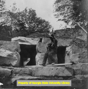 Man on stone structure, C. J. French collection