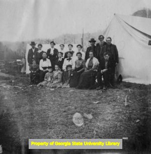 Group outside of tent, C. J. French collection