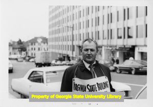Virginia State Building Trades Council supporter walks the picket line.