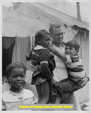 National Council of the Churches of Christ missionary plays with children of migrant laborers