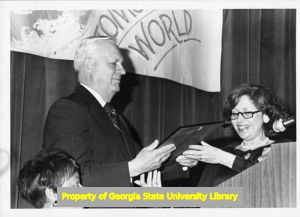 E. T. Kehrer accepts award from the Kansas City Metropolitan Commission on the Status of Women.