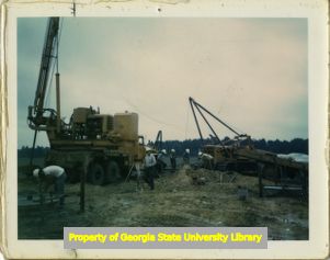 Electrical workers and construction equipment