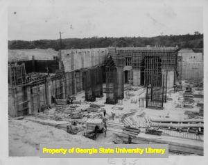 Construction in progress on the foundation and basement of a building.