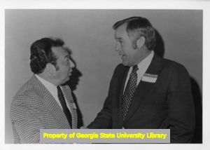Herbert Mabry shaking hands with Nicholas Bonanno