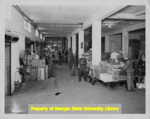 Employees checking orders at a grocery distributor warehouse, Norfolk, Virginia, 1930s.