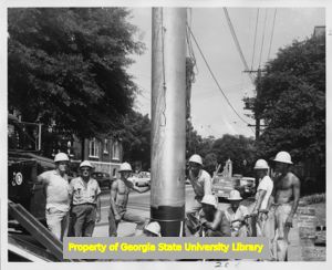 IBEW Local 84 members working on an electric line pole, Atlanta, Georgia, June 1962.