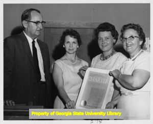 Women of the IBEW Local 84 Women's Auxiliary with their charter, Atlanta, Georgia, 1963.