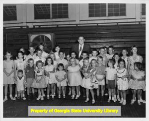 IBEW member Bill Lowery and a group of children, Atlanta, Georgia.