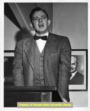 Paul R. Christopher speaking at podium, 1940s.