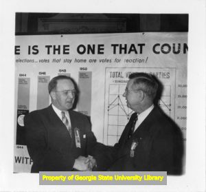 Delegates shaking hands at a CIO Constitutional Convention, Chicago, Illinois, November 1950.
