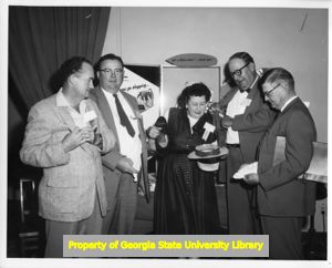 Checking for union labels at the Mississippi Labor Council convention, Jackson, Mississippi, April 1958.