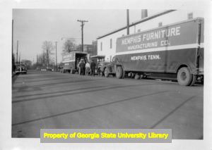 UFWA members boarding Memphis Furniture Manufacturing Company trucks during a strike.
