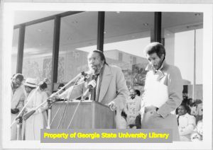 Comedian Dick Gregory introducing speaker at MLK rally, Atlanta, Georgia, January 15, 1985.