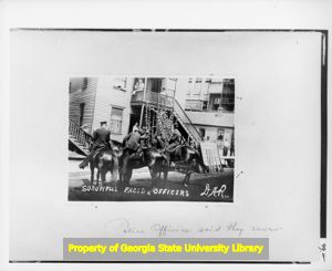 Mounted police patrolling the Fulton Bag and Cotton Mill company housing