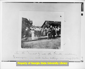 Textile workers eating watermelon during the Fulton Bag and Cotton Mill Strike