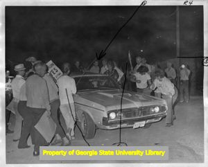 Striking United Textile Workers of America, Local 532 members picketing outside a Leon-Ferenbach textile plant, 1973