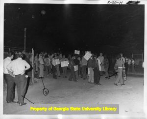 Striking United Textile Workers of America, Local 532 members picketing outside a Leon-Ferenbach textile plant, 1973