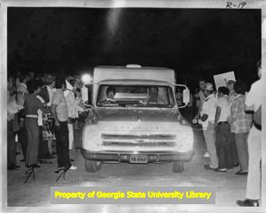 Striking United Textile Workers of America, Local 532 members picketing outside a Leon-Ferenbach textile plant, 1973