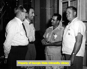 Four union members in informal conversation, UTW 13th Biennial Convention, Ambassador Hotel, Atlantic City, New Jersey, August 1954.