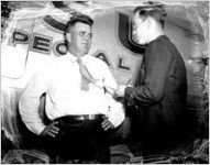 Louisiana State University football coach Bernie Moore being interviewed