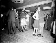 "High Hat," dance and party, African-American party, on Auburn Avenue, Atlanta, Georgia, January 21, 1943. Photo shoot commissioned by fashion and home-goods mail-order merchandizer, Chicago Mail Order Company, owned by Alden's