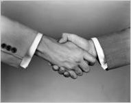 Advertising photograph of two men's handshake, for Kirkland, White, and Schell Advertising Agency, July 21, 1954