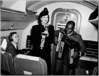 Davison's "Flying Fashions," six shows in four cities in one day. Fashion show aboard an airplane. Photo shoot at Candler Field, Atlanta, Georgia, September 19, 1946
