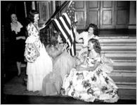 Formally dressed women with American flag