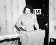 Women's Army Corps member ironing uniforms, Atlanta, Georgia, 1943.