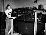 Worker adjusting an airplane instrument panel, Atlanta, Georgia, July 9, 1951