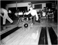 Man bowling at a bowling event