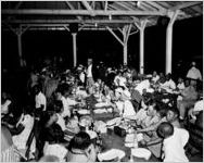 Davison-Paxon Company sponsored segregated staff outings, such as this nighttime picnic for African Americans. An Atlanta, Georgia, park, August 18, 1954