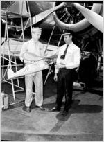 Glider contest participant holding glider (James Shelby Charles?), photograph commissioned by Eastern Air Lines, 1941