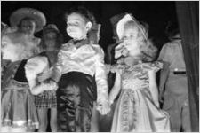 Young talent show performers standing on stage, Georgia, 1930s