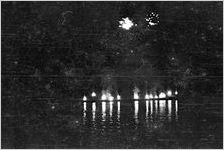Nightly fireworks shot from a floating barge as a part of the 7-day Rubin and Cherry Exposition, held during the 24th annual Southeastern Fair, at Lakewood Park. Designers of the fireworks at the World's Fair showed up months in advance to prepare. Atlanta, Georgia, October 2, 1938.