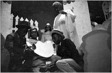 Men shooting dice, scene from the morality play "Heaven Bound," staged by the Big Bethel African Methodist Choir, at the Atlanta Theatre (23 Exchange Place), Atlanta, Georgia, August 1937