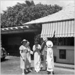 People standing in front of the Hind-Clarke Dairy Ice Cream Stand, Aina Haina Valley, Honolulu, Hawaii, 1930s