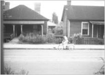 Bicyclist on an unknown street, Atlanta?, Georgia, 1930s
