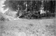 Tractor harvesting hay, Georgia, 1930s