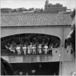 Military band performing on a covered balcony, Honolulu, Hawaii, 1930s