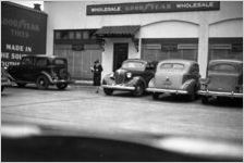 Cars parked outside of a Goodyear wholesale store, Atlanta, Georgia, 1930s