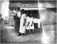 African American family in front of their home.