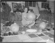 Young girl with a gourd at the Pine Mountain Valley Fair, 1939
